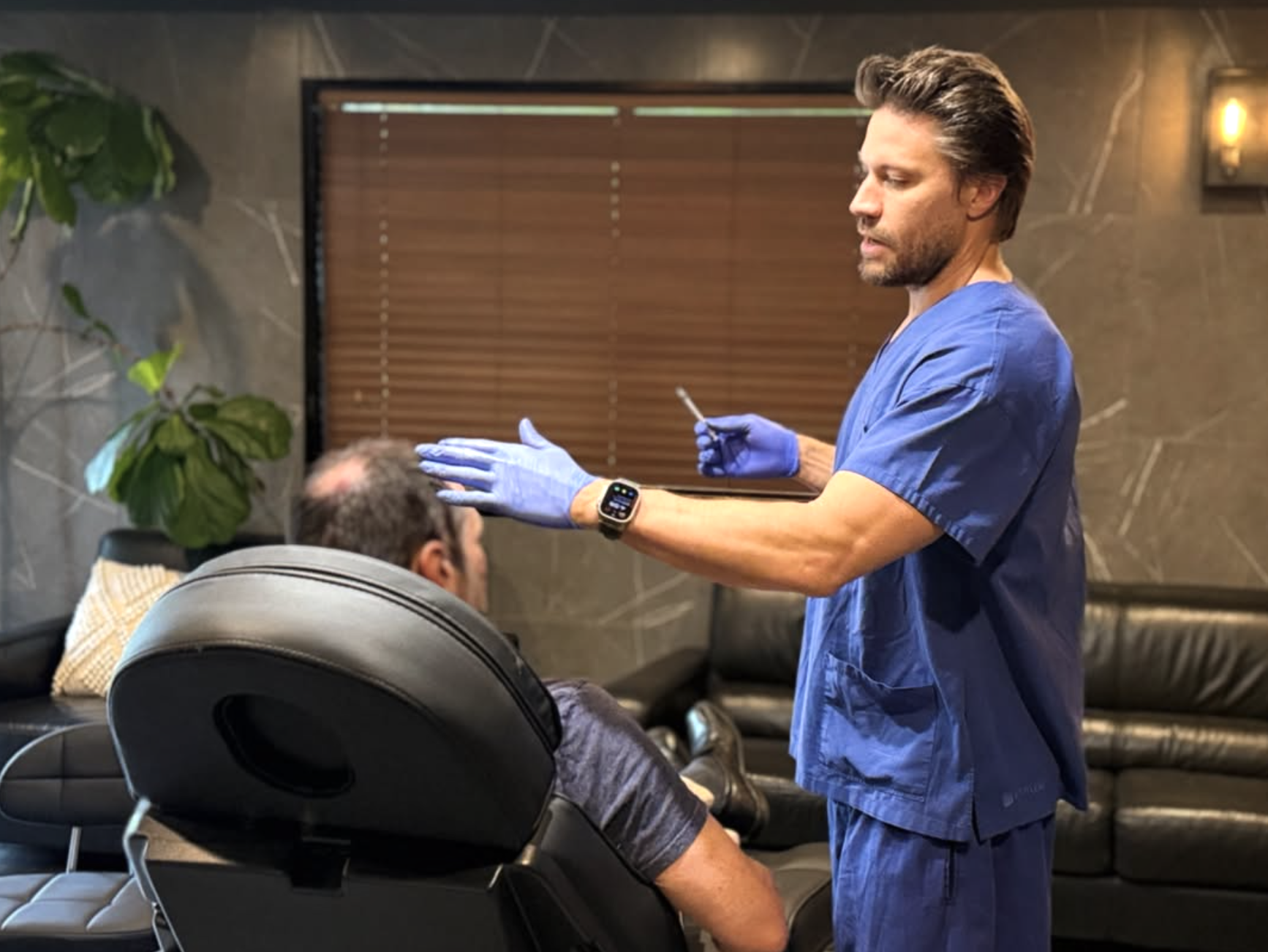 Dr Kynan Nahrung performing a treatment at his Mermaid Waters clinic